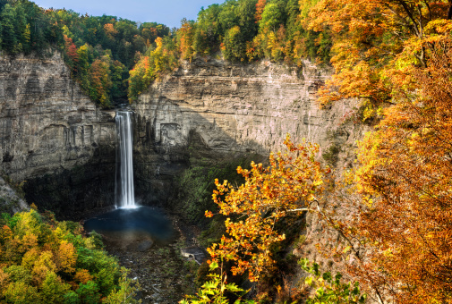 Taughannock Falls is  located in Ulysses,Y New York. Photo taken from an overlook during fall. A gorgeous 215 foot waterfall found in the Finger Lakes region.