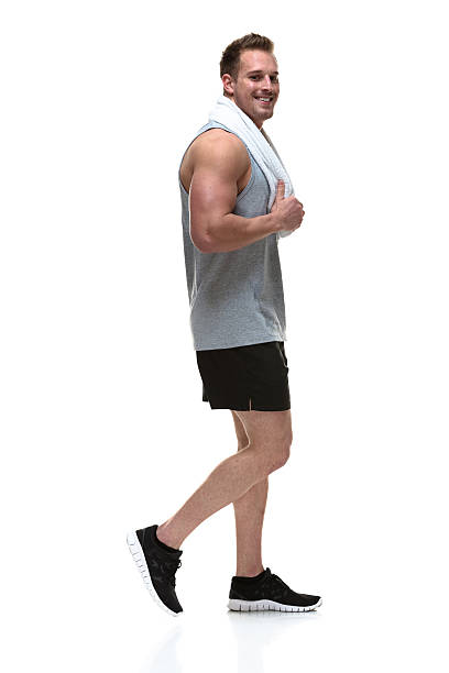 istock Muscular man walking with towel 459570787