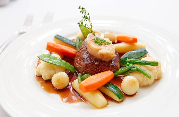 Tenderloin steak with steam cooked vegetables and  bone marrow