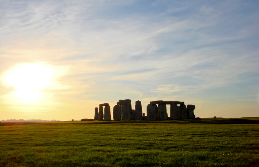 UNESCO World Heritage Site at Stonehenge, Wiltshire, UK. Sun shines through the stones. Major tourist destination, archeological and pilgrimage site during Summer Solstice and Winter Solstice.