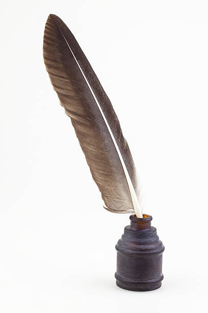 istock vintage glass inkwell and old pen isolated 459593393