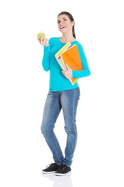 istock Beautiful young student with files and apple. 459593837