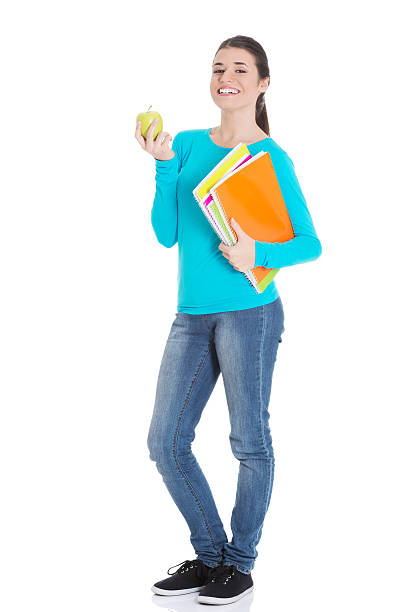 istock Beautiful young student with files and apple. 459593895