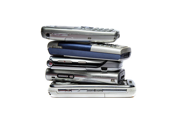 istock Stacked old faulty mobile phones 459594295