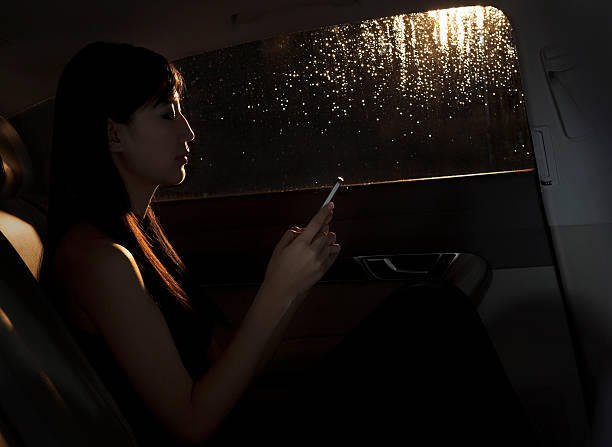 istock Young woman texting on her phone 459595045