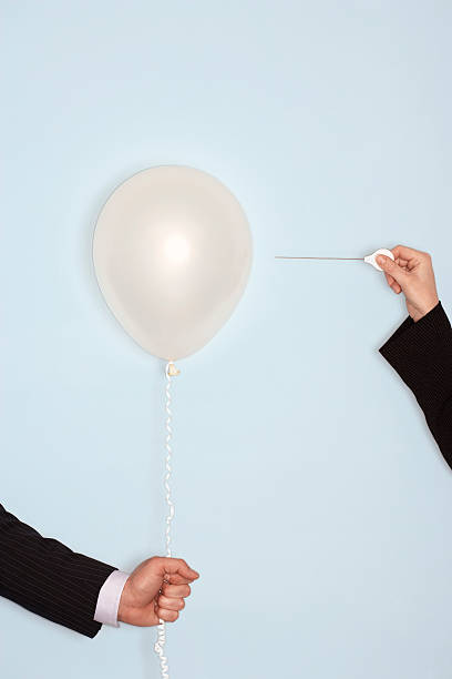 istock Hands With Needle And Balloon Against Blue Background 459595629