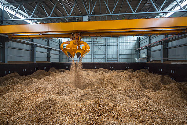 Piles of wood chips in storage stock photo
