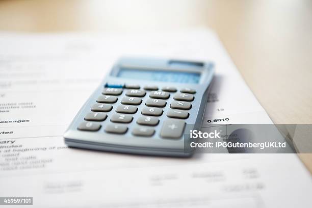 Calculator And Financial Bill Stock Photo - Download Image Now - Blank, Blurred Motion, Business