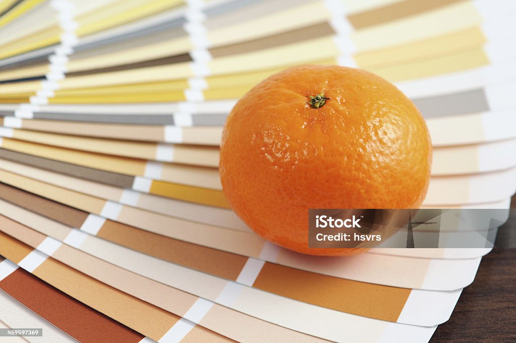 Orange on color Swatch home improvement painting orange on a Color Swatch for home improvement painting in brown, orange and yellow Abstract Stock Photo