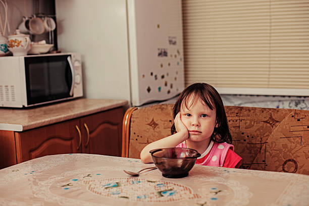Portrait. The child is hungry. hungry stock pictures, royalty-free photos & images