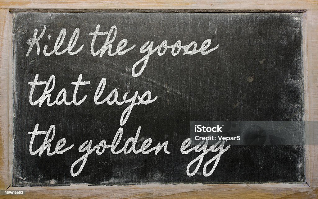expression -  Kill the goose that lays golden egg handwriting blackboard writings - Kill the goose that lays the golden egg Animal Egg Stock Photo