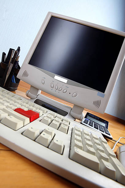 istock keyboard and monitor at table 459617303