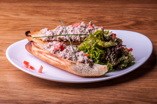 tuna salad sandwich with lettuce on plate