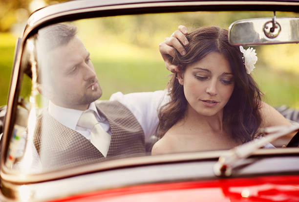 istock Wedding car with bride and groom 459633339