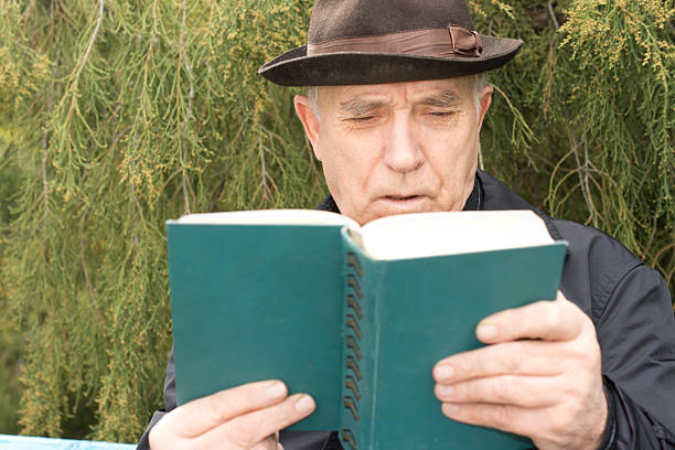 istock Senior man enjoying his novel 459672165