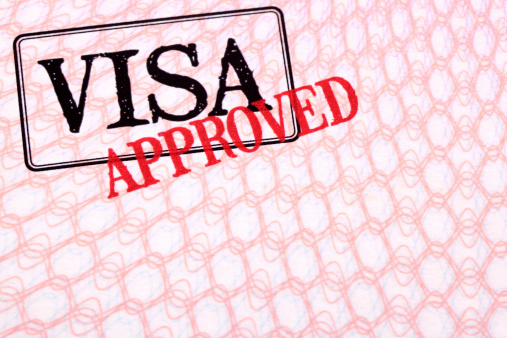 Approved visa stamp on the inside page of a passport.  Space for copy.