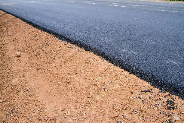 istock New asphalt. Reconstruction of road 459698195