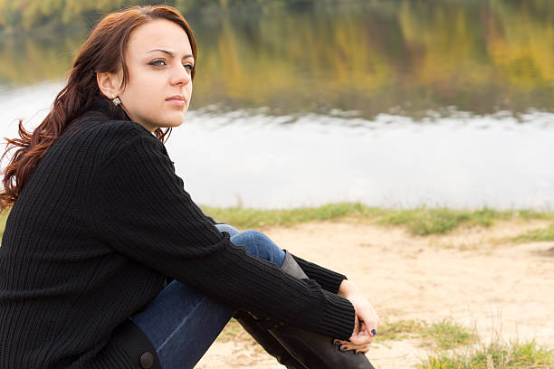 istock Young woman watching something intently 459709369