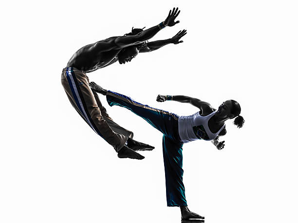 istock couple capoeira dancers dancing silhouette 459709497
