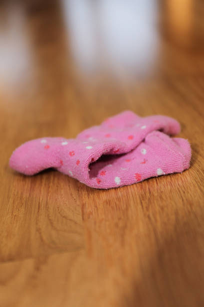 Sock left on the floor stock photo