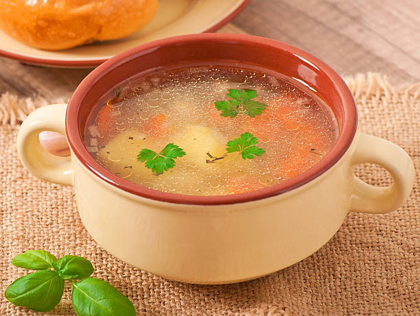 istock Chicken soup in the brown ceramic bowl 459710097