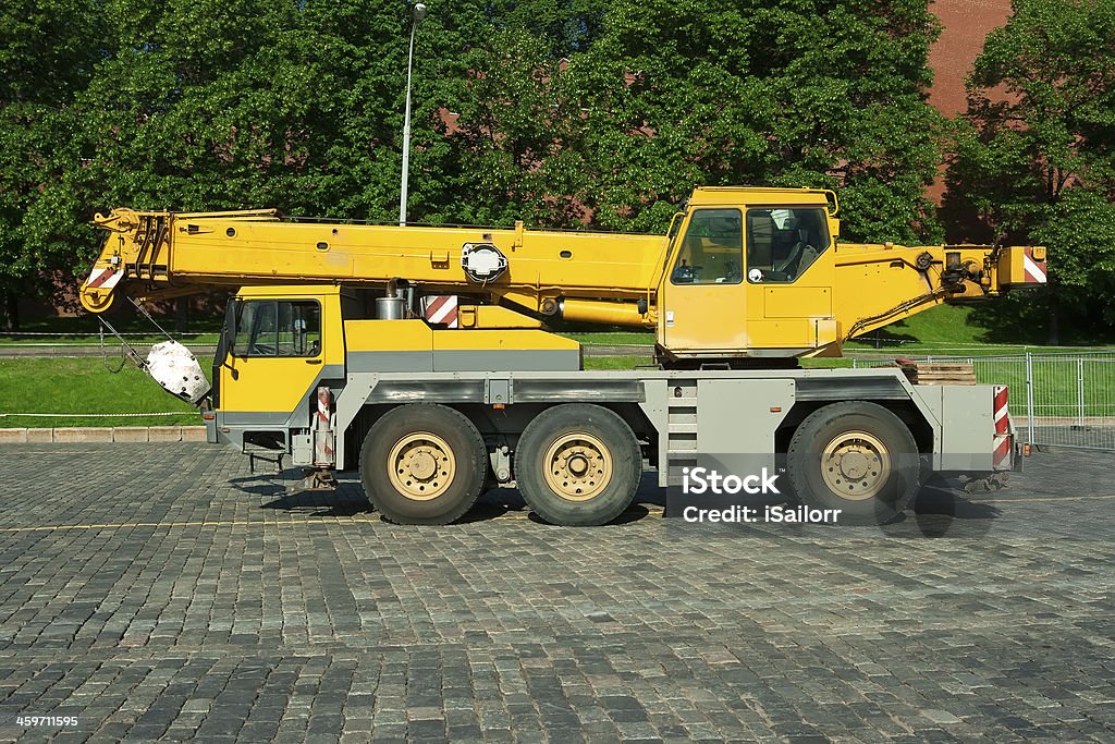 Automobile crane Big yellow automobile crane with telescopic boom Pick-up Truck Stock Photo