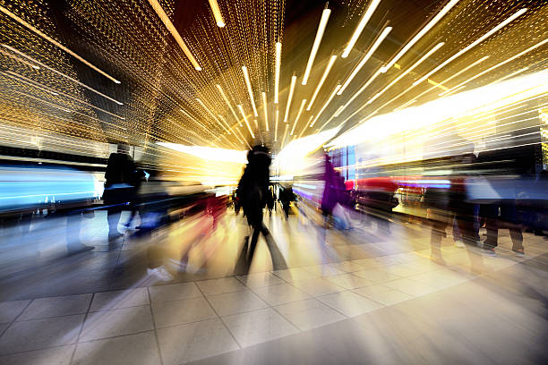 istock Blurred pedestrians exits building, at Christmas time 459722579
