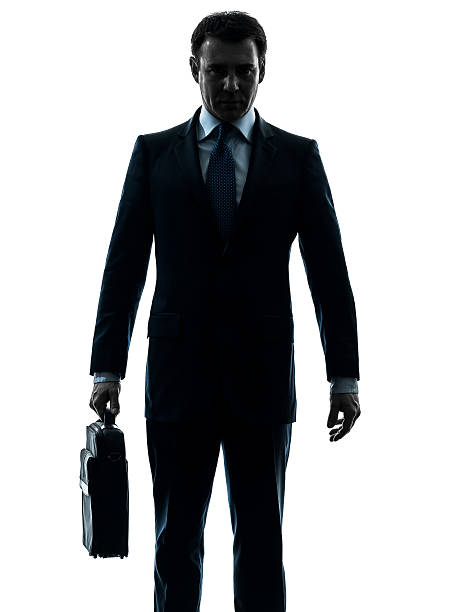 istock business man serious holding briefcase silhouette 459856973