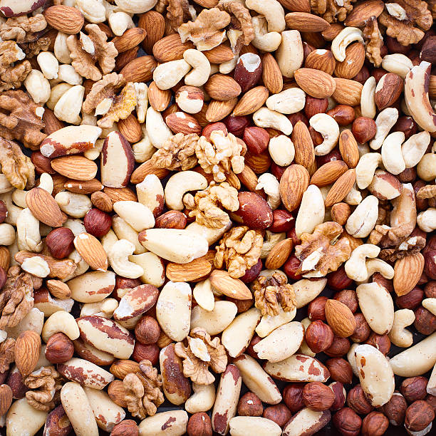 istock Hazelnuts, filbert on old wooden background 459859763