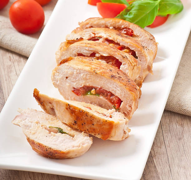 istock Grilled chicken breast stuffed with basil, tomato and garlic 459865655