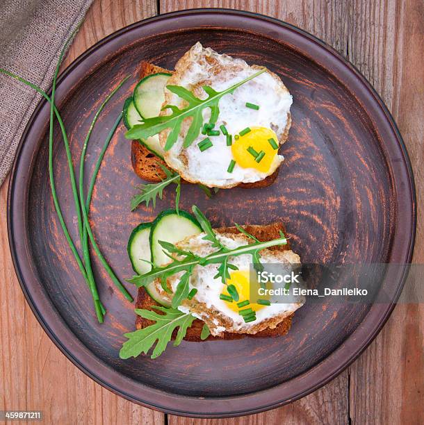 Toast With Fried Egg Cucumber And Arugula Stock Photo - Download Image Now - Appetizer, Arugula, Bread