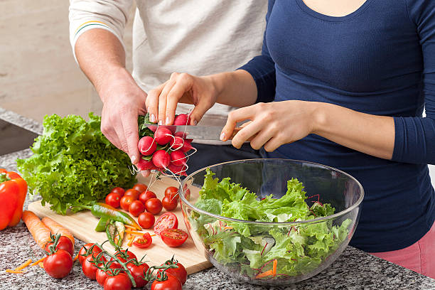 istock Cutting off a piece of radish for salad 459873663