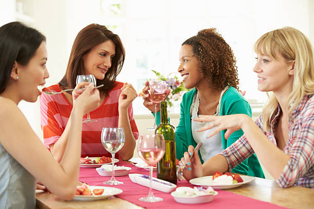 istock Female friends having dessert together at a table 459873673