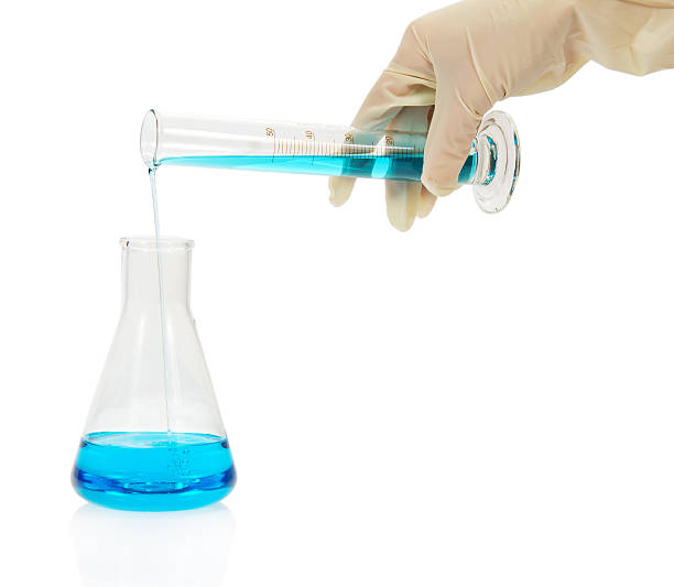 istock Test-tube with blue liquid for chemical in hand 459874675