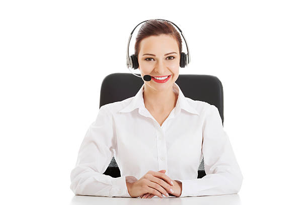 Beautiful woman sitting with microphone and headphones. stock photo