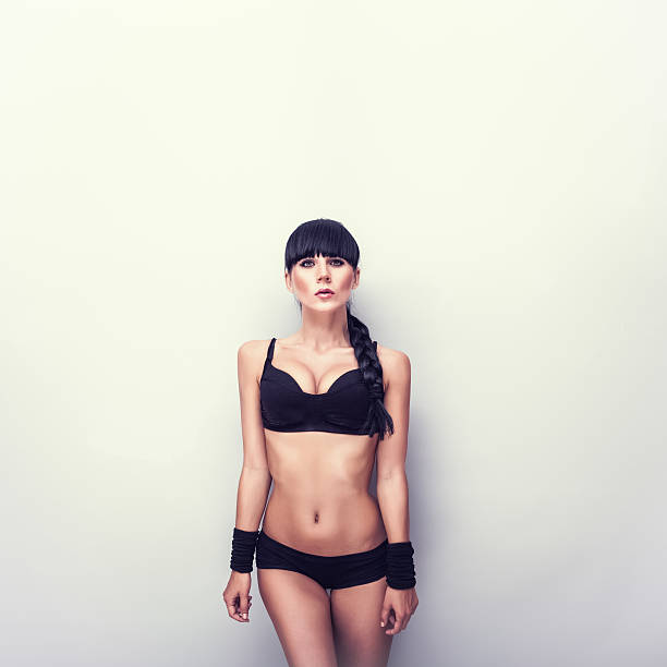 young athletic girl at a wall