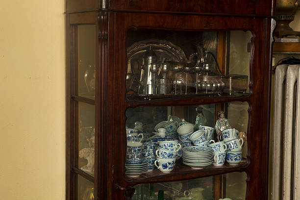 istock Antique dishware silver plated, cups, utensils and china 459875683