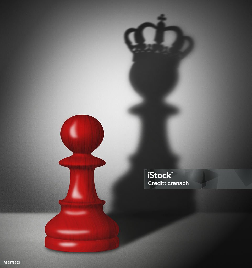 Chess pawn with the shadow of a king Red chess pawn with the shadow of a king. Chess Stock Photo