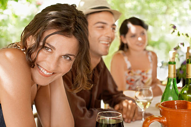 istock Woman With Friends Enjoying Drinks 459877197