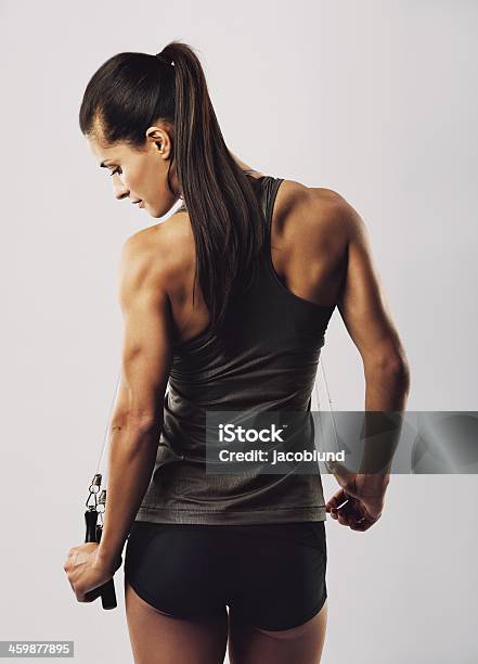 Posing Female Athlete With Jump Rope Stock Photo - Download Image Now - Holding, Jump Rope, Jumping Rope