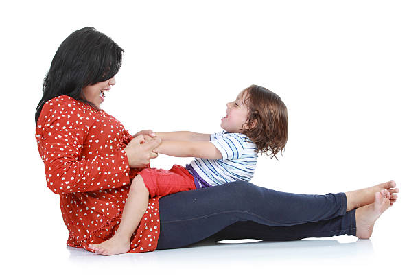 feliz mãe com menino sorridente - love hanging indoors studio shot imagens e fotografias de stock