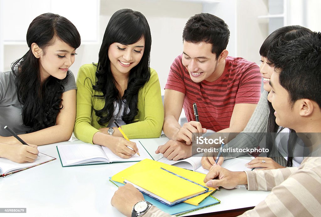 A group of students that are studying together Group of asian students studying together at home Learning Stock Photo