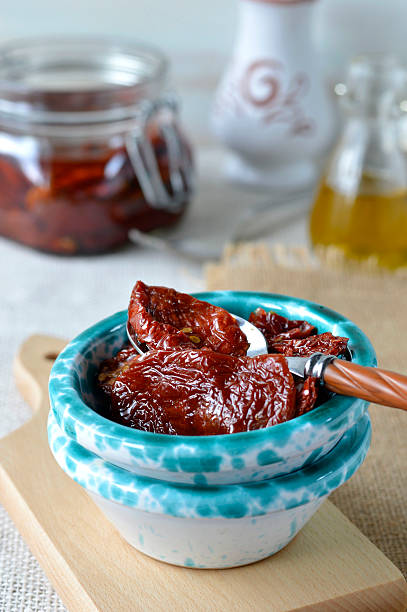 Italian sun-dried tomatoes in olive oil. Pomodori secchi sott'olio. stock photo