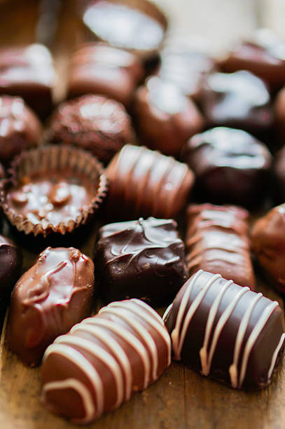 istock Assorted Chocolate pralines on brown background 459887231