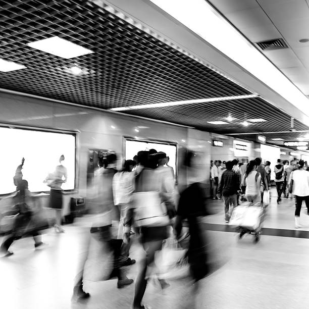 istock black and white blur passenger walk at subway station 459888149