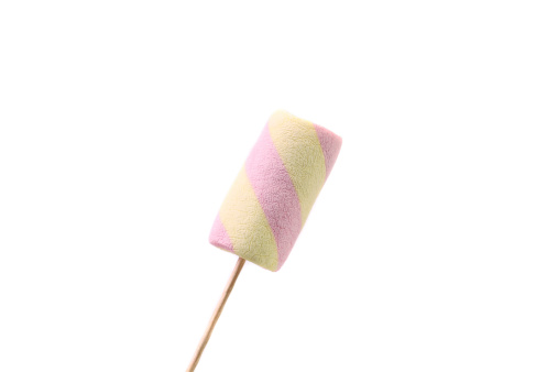 Marshmallow candies on stick. Isolated on a white background.