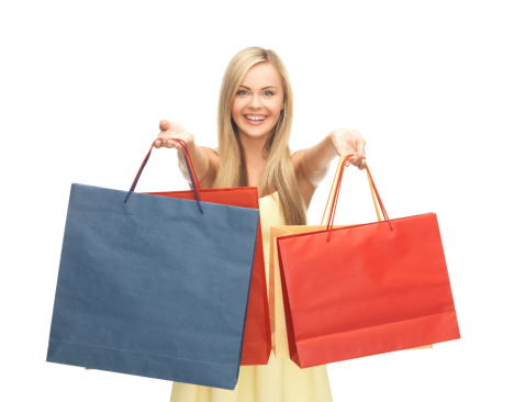 picture of happy woman with shopping bags .