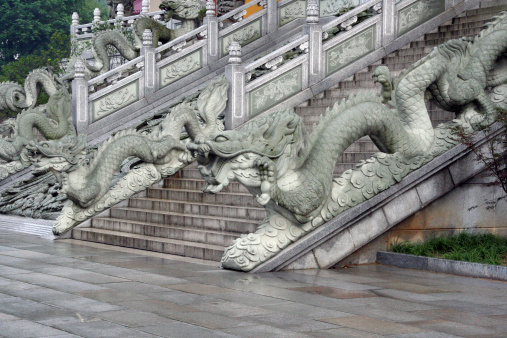 Stairs to a buddhist temple in Jiuhuashan, Anhui Province, China, decorated with stone dragon statues. Jiuhuashan is one of the four famous holy mountains of buddhism in China.