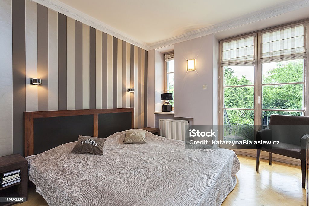 Vintage mansion - bed Vintage mansion - a comfy beige bed with pillows Apartment Stock Photo