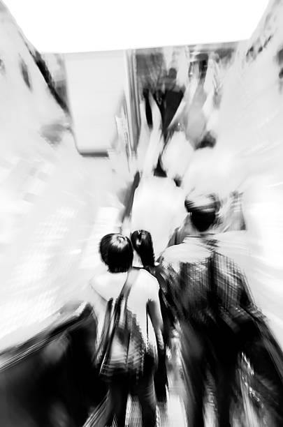 istock business people on escalator abstract blur 459895253